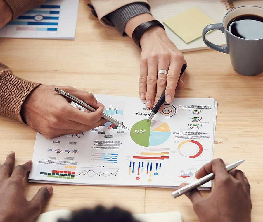 People Discussing Charts and Graphs People Discussing Charts and Graphs